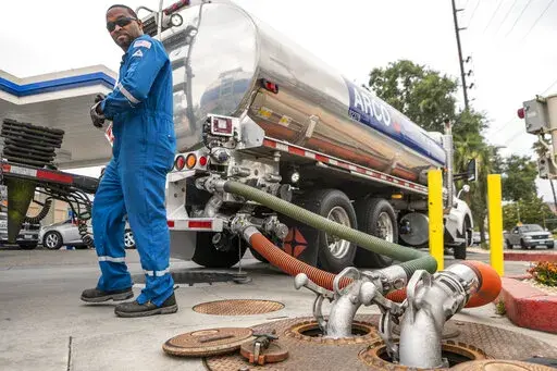 A driver delivers 8,500 gallons of gasoline at an ARCO gas station in Riverside, Calif., Saturday, May 28, 2022. (AP Photo/Damian Dovarganes, File)