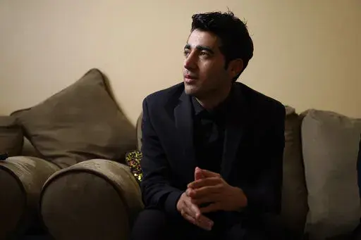 Inamullah Niazai speaks during an interview Tuesday, April 26, 2022, in St. Louis. Niazai is one of about 600 people who have fled Afganistan and made it to St. Louis in the nearly nine months since the Afghan capital of Kabul was ceded to the Taliban, with another 750 expected by later this year. (AP Photo/Jeff Roberson)