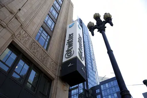 A sign is pictured outside the Twitter headquarters in San Francisco, Monday, April 25, 2022. Trading in shares of Twitter were halted, Tuesday, Oct. 4,  after the stock spiked on reports that Elon Musk would proceed with his $44 billion deal to buy the company after months of legal battles.(AP Photo/Jed Jacobsohn, File)