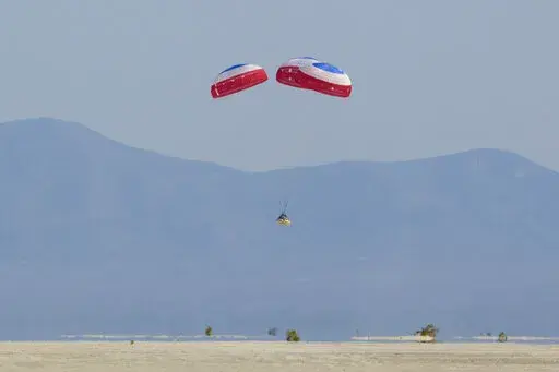 Boeing's CST-100 Starliner spacecraft lands at White Sands Missile Range's Space Harbor, Wednesday, May 25, 2022, in New Mexico. (Bill Ingalls/NASA via AP)