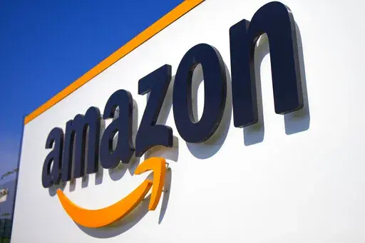 The Amazon logo is seen in Douai, northern France, April 16, 2020. In August 2022, Amazon has said it will spend billions of dollars in two gigantic acquisitions that, if approved, will broaden its ever growing presence in the lives of consumers. This time, the company is targeting two areas: health care and the "smart home." (AP Photo/Michel Spingler, File)
