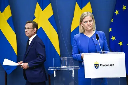 Sweden's Prime Minister Magdalena Andersson, right, and the Moderate Party's leader Ulf Kristersson give a news conference in Stockholm, Sweden, Monday, May 16, 2022. Sweden's government has decided to apply for a NATO membership. (Henrik Montgomery/TT News Agency via AP)