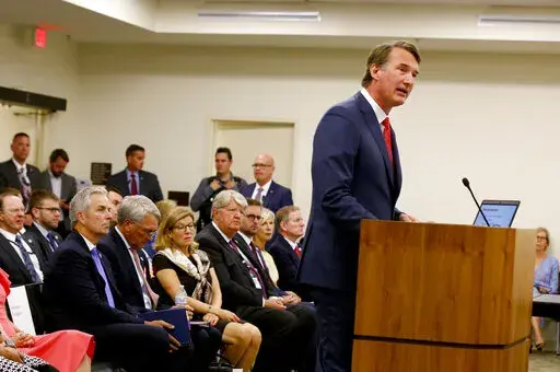 Virginia Gov. Glenn Youngkin spoke at a joint meeting of the House Appropriations, House Finance and Senate Finance & Appropriations Committees at Pocahontas Building in Richmond, Va., on Friday, Aug. 19, 2022. (Daniel Sangjib Min/Richmond Times-Dispatch via AP)