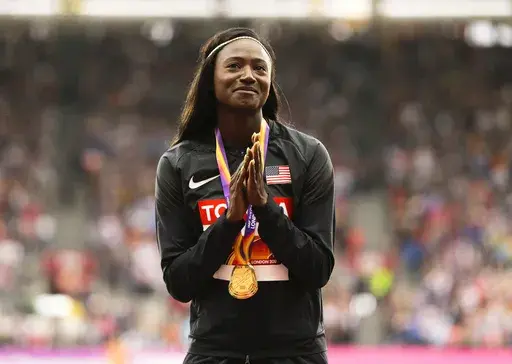 United States' Tori Bowie gestures after receiving the gold medal she won in the women's 100m final during the World Athletics Championships in London, Monday, Aug. 7, 2017. Tori Bowie, the sprinter who won three Olympic medals at the 2016 Rio de Janeiro Games, has died, her management company and USA Track and Field said Wednesday, May 3, 2023. Bowie was 32. She was found Tuesday in her Florida home. No cause of death was given. (AP Photo/Alastair Grant, File)