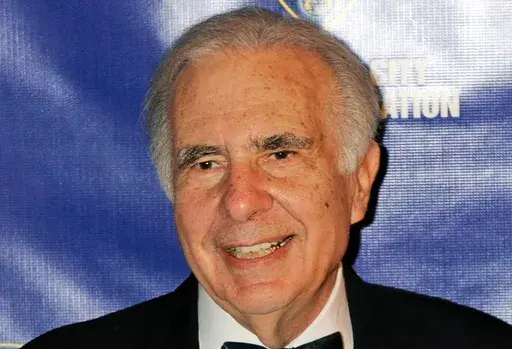 Financier Carl Icahn poses for photos upon arriving for the annual New York City Police Foundation Gala in New York, March 16, 2010. (AP Photo/Henny Ray Abrams, File)
