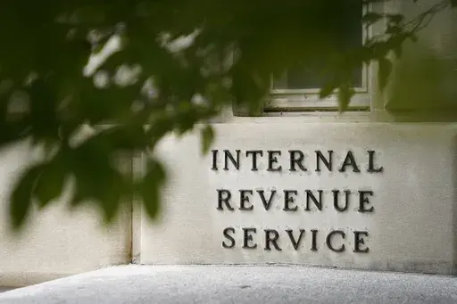 A sign is displayed outside the Internal Revenue Service building on May 4, 2021, in Washington. (AP Photo/Patrick Semansky, File)