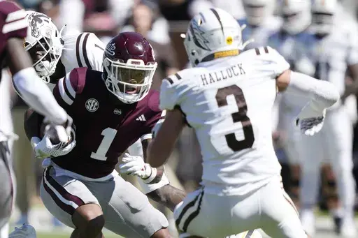 Mississippi State wide receiver Zavion Thomas (1) takes a pass upfield for a first down against Western Michigan safety Tate Hallock (3) during the second half of an NCAA college football game, Saturday, Oct. 7, 2023, in Starkville, Miss. Mississippi State won 41-28. (AP Photo/Rogelio V. Solis)