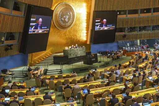 Live video monitors show United Nations Ambassador from Russia, Vasily Nebenzya, addressing the U.N. General Assembly before a vote on a resolution condemning Russia's illegal referendum in Ukraine, Wednesday Oct. 12, 2022 at U.N. headquarters. (AP Photo/Bebeto Matthews)