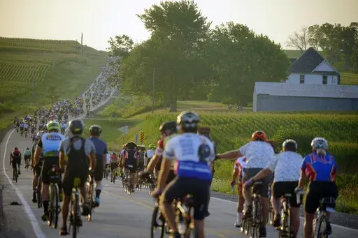 Riders roll out of Tama-Toledo, Iowa, during RAGBRAI 50, Friday, July 28, 2023. (Zach Boyden-Holmes/The Des Moines Register via AP)